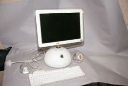 AN APPLE iMAC G4 M6498 PERSONAL COMPUTER with 1.25Hz /256Mb/80HD, wired keyboard and mouse and a