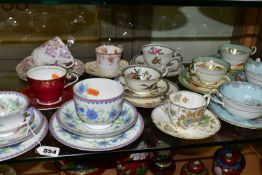 A GROUP OF AYNSLEY TRIOS AND SOUP BOWLS, comprising two soup bowls with two saucers in the 'Queen'
