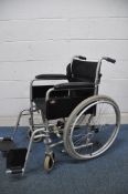 A ENIGMA LAWC001 self propelled wheelchair with footrests and seat belt (condition- good used