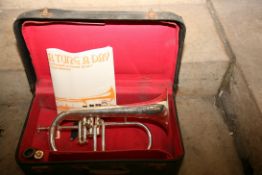 A BESSON AND CO CORNET with silver coloured finish, mouthpiece in leather case and an instrument