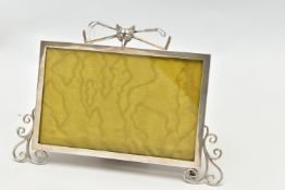 AN EARLY 20TH CENTURY SILVER PHOTOFRAME, polished frame detailed with scroll work to the bottom