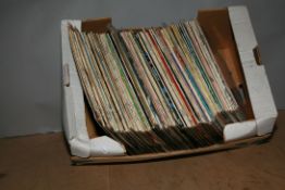 A TRAY CONTAINING APPROX ONE HUNDRED LPs BY ELVIS PRESLEY including some originals, some reissues