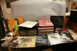 TWO RECORD CASES CONTAINING OVER SIXTY ROCK, PUNK AND POST PUNK ROCK MUSIC including Give em