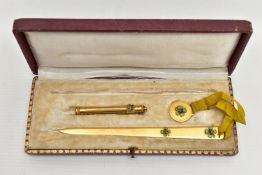 A CASED EARLY 20TH CENTUY GILT METAL AND ENAMELLED FOUR LEAF CLOVER DESIGN DESK/ WRITING SET, the