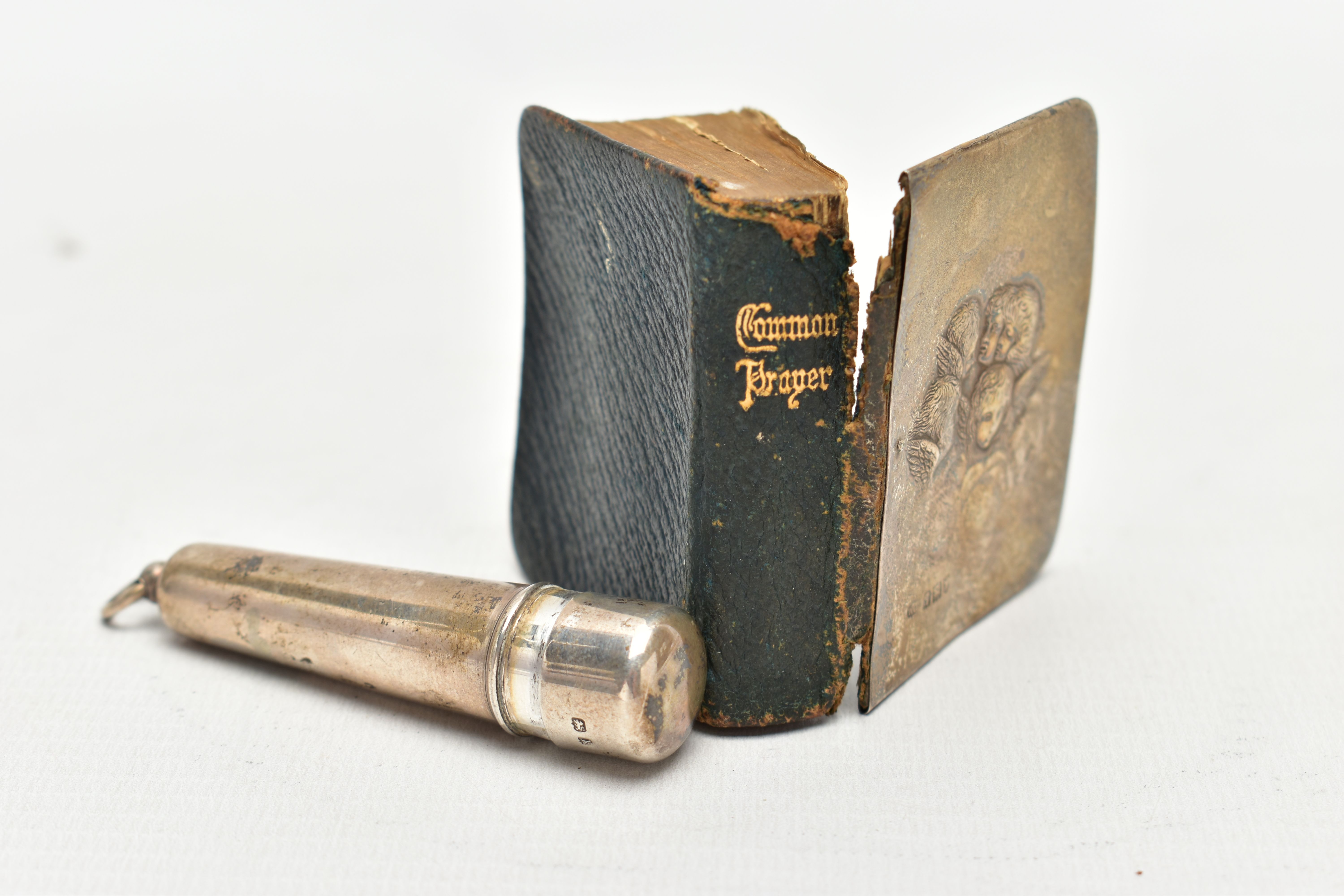 A SILVER PRAYER BOOK AND CIGAR HOLDER, the book with silver front panel depicting five Cherubs, - Image 2 of 4
