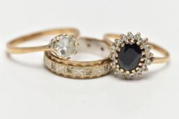 TWO 9CT GOLD RINGS AND A YELLOW AND WHITE METAL RING, the first an oval cut sapphire set with a