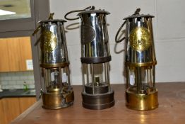 THREE BRASS AND STEEL MINER'S LAMPS, comprising an E Thomas & Williams Ltd Cambrian lamp, no