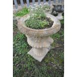 A COMPOSITE CAMPAGNA STYLE GARDEN URN with twin mask handles height 65cm