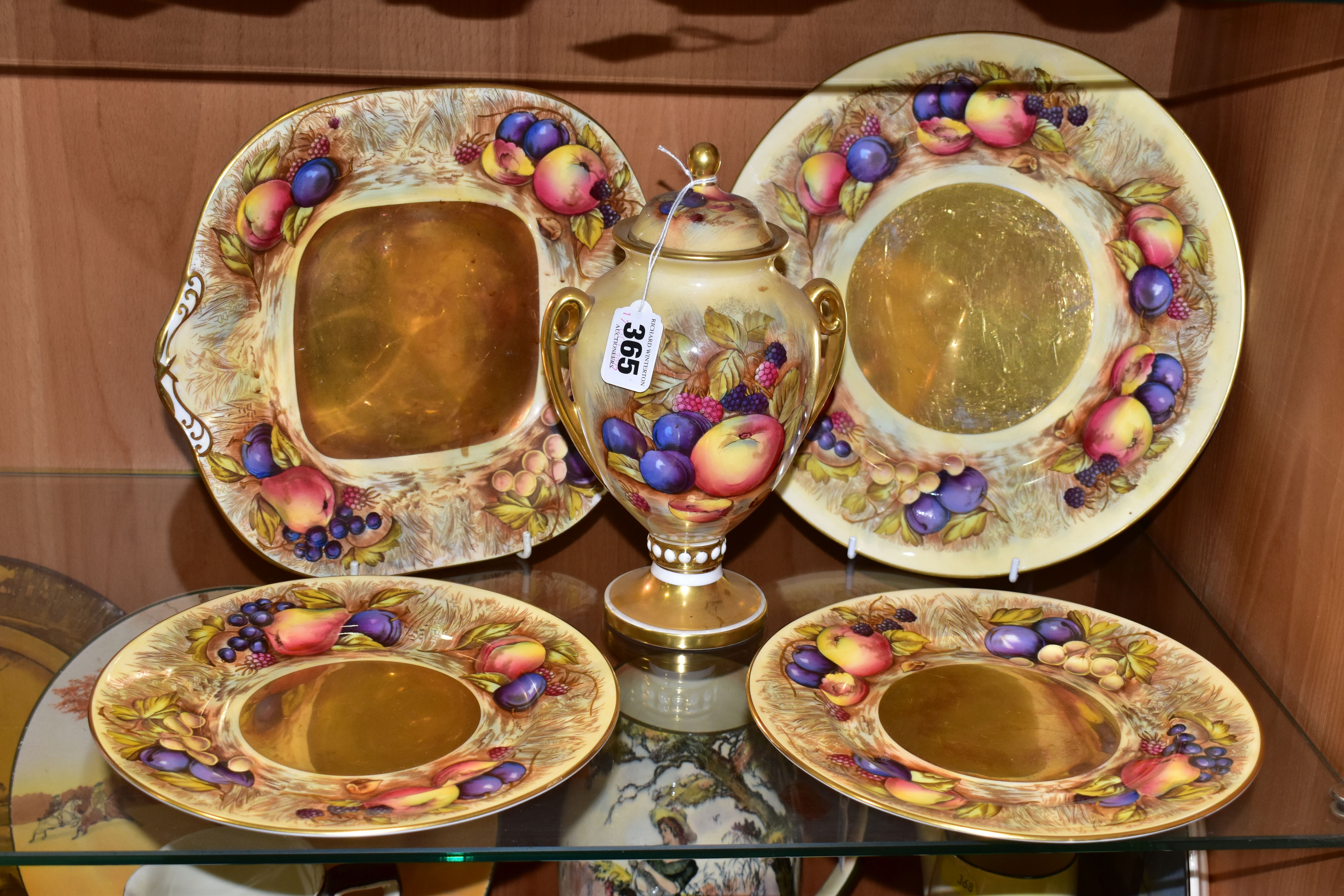 FIVE PIECES OF AYNSLEY FRUIT PATTERN CHINA, bearing D. Jones signatures, comprising a twin handled