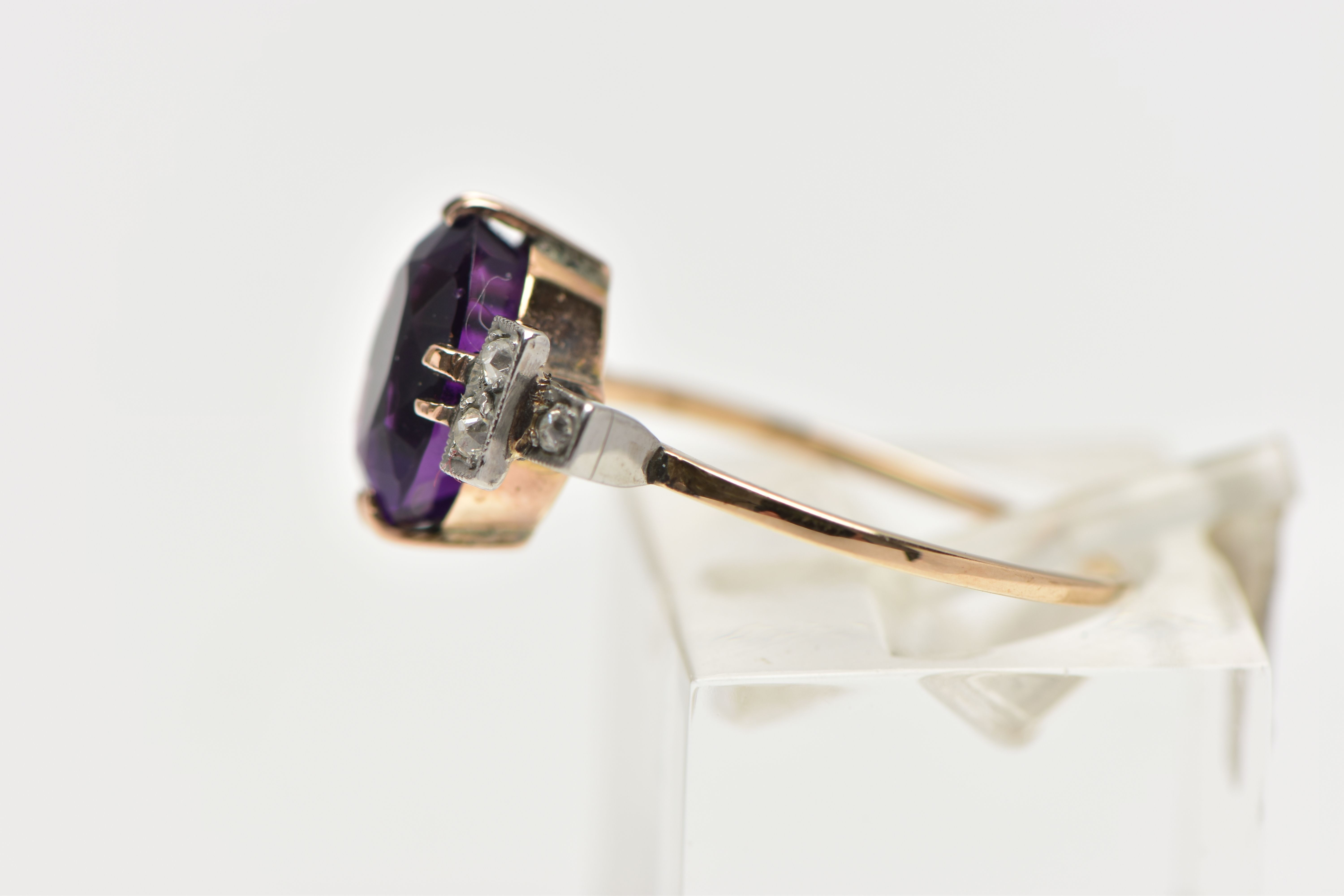 AN EARLY 20TH CENTURY DRESS RING, an oval cut deep purple amethyst, prong set in yellow gold, - Image 2 of 4