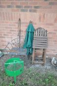 TWO FOLDING WOODEN GARDEN CHAIRS, a metal stool, a metal hanging basket on stand, a parasol top