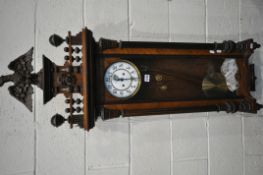 A 19TH CENTURY WALNUT CASED EIGHT DAY GUSTAV BECKER WALL CLOCK, the pediment depicting an eagle,