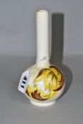A MOORCROFT POTTERY BUD VASE, 'Leaves in the Wind' yellow and brown leaf pattern on a cream