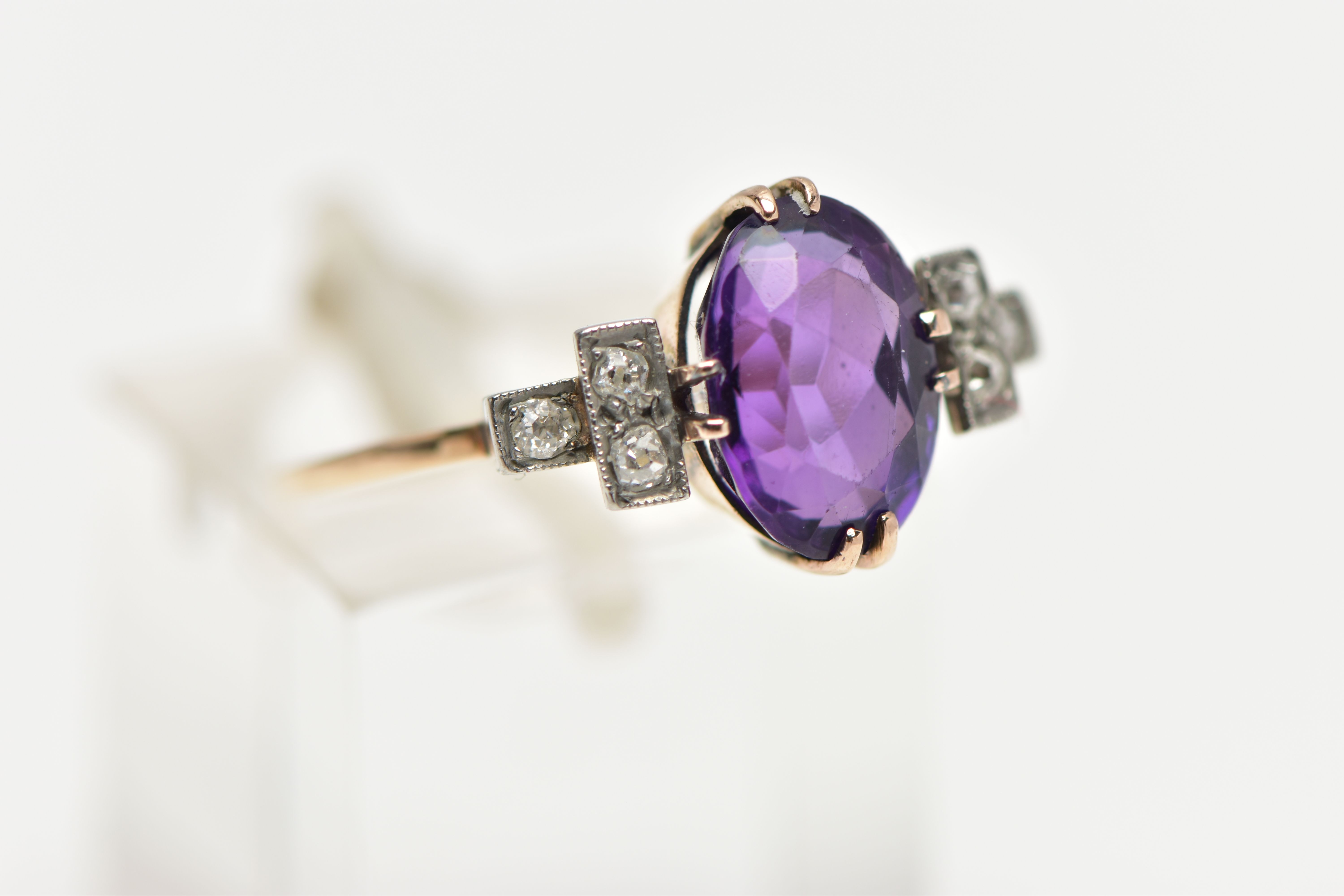 AN EARLY 20TH CENTURY DRESS RING, an oval cut deep purple amethyst, prong set in yellow gold, - Image 4 of 4