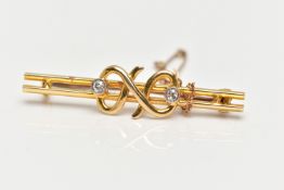 A YELLOW METAL DIAMOND SET BAR BROOCH, double polished bar with a central twist design flanked