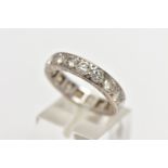 A DIAMOND ETERNITY BAND RING, a full eternity ring set with nineteen round brilliant cut diamonds,