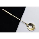 A WHITE METAL CONDIMENT SPOON, twisted handle, engraved floral detail to the reverse of the bowl,