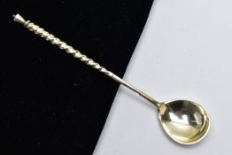 A WHITE METAL CONDIMENT SPOON, twisted handle, engraved floral detail to the reverse of the bowl,