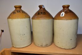 THREE STONEWARE FLAGONS PRINTED S.R.D. TO THE SHOULDER, one having a 'W' impressed maker's stamp