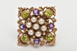 A 9CT GOLD PERIDOT, AMETHYST AND SPLIT PEARL BROOCH, of openwork floral design, the center set