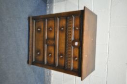 A SOLID OAK JACOBEAN STYLE CHEST OF FIVE ASSORTED DRAWERS, width 76cm x depth 46cm x height 92cm (