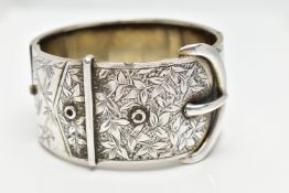 A WHITE METAL HINGED BANGLE, wide bangle approximate width 30.3mm, in the form of a belt and