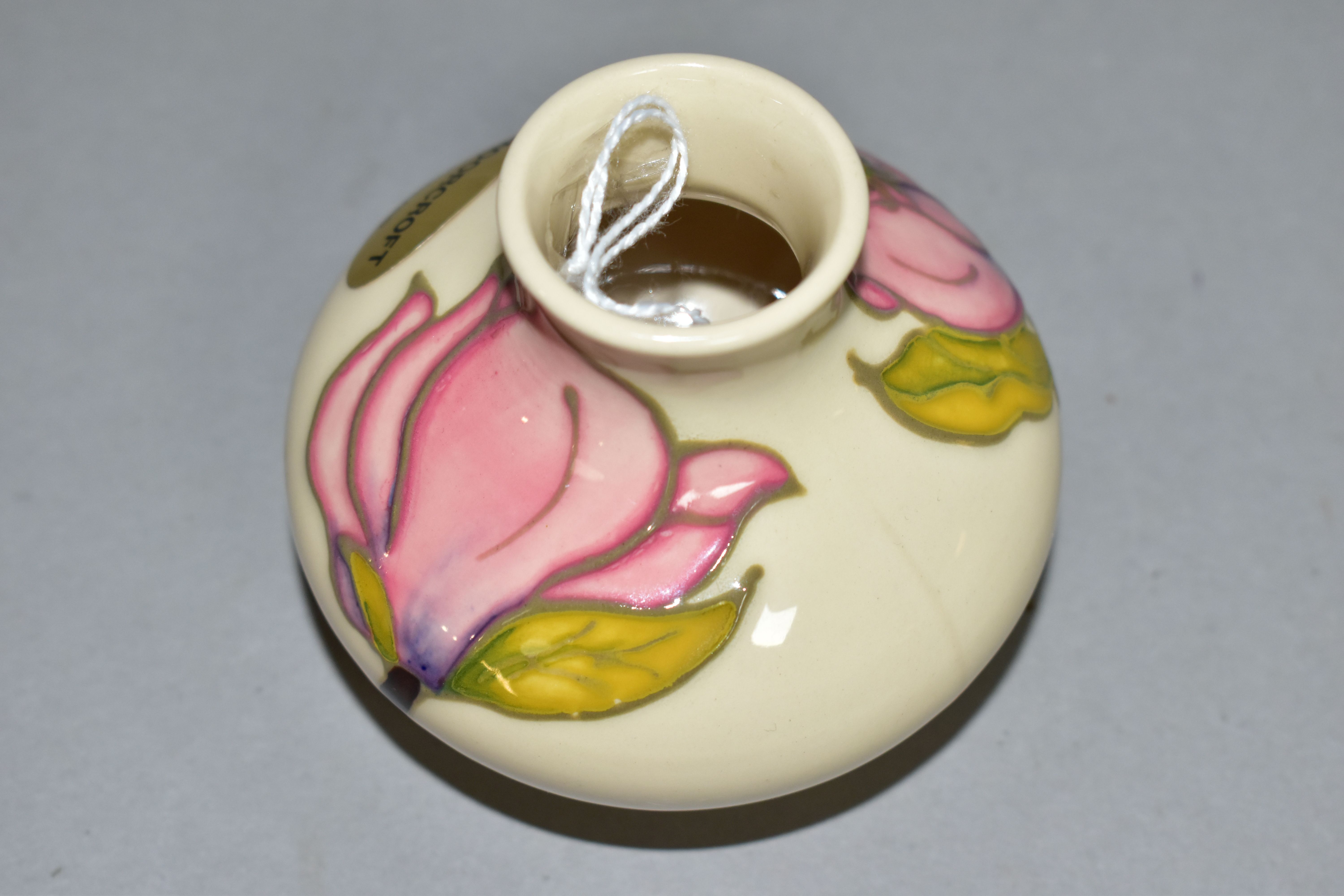 A MOORCROFT POTTERY SQUAT BALUSTER VASE DECORATED WITH PINK MAGNOLIA ON A CREAM GROUND, bears gilt - Image 3 of 4