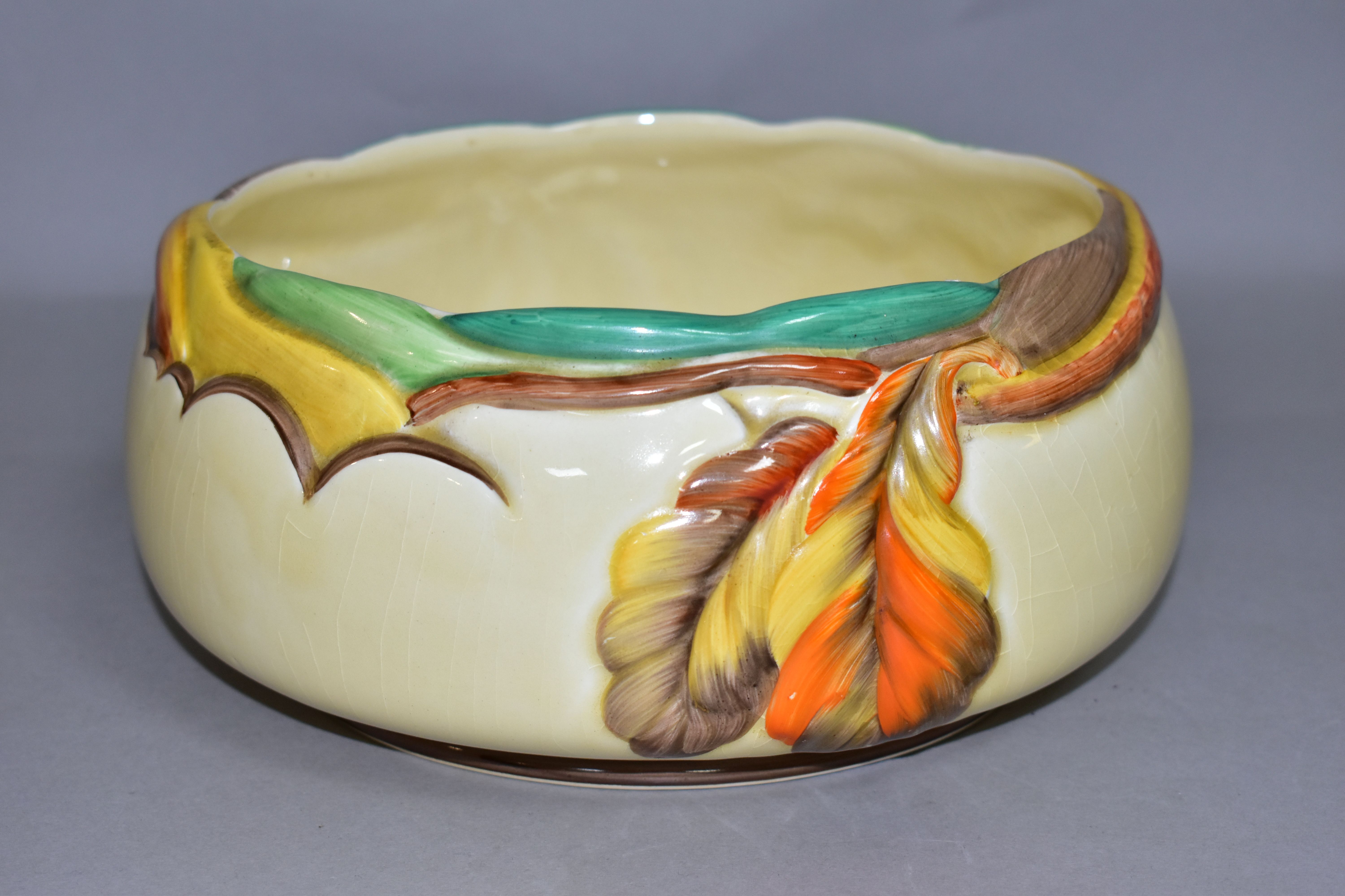 A CLARICE CLIFF FOR NEWPORT POTTERY FRUIT OR SALAD BOWL MOULDED WITH AUTUMNAL LEAVES, printed marks,