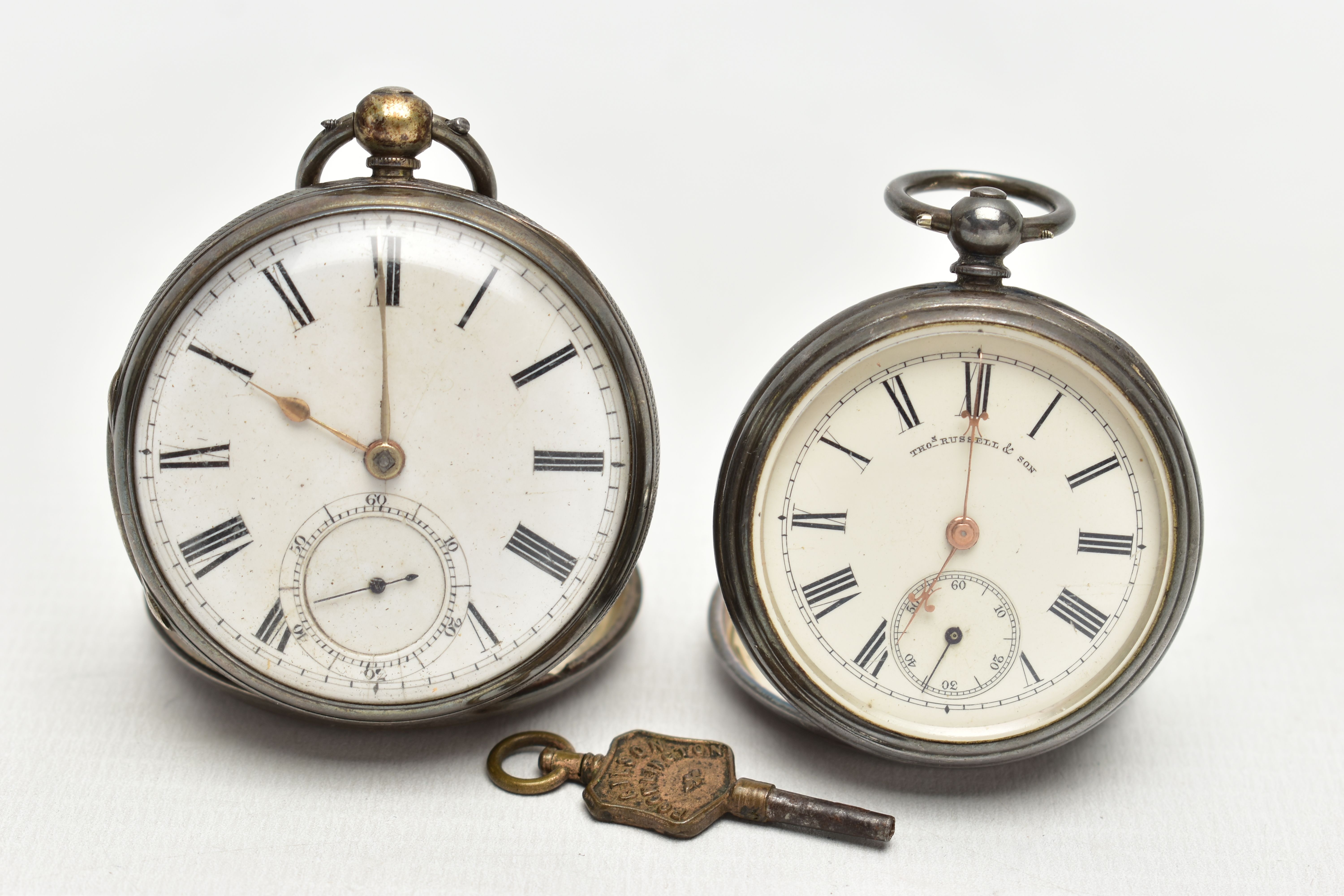 TWO OPEN FACE POCKET WATCHES AND WATCH KEY, the first a silver open face pocket watch, key wound,