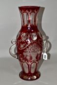A LATE 19TH CENTURY BOHEMIAN GLASS TWIN HANDLED BALUSTER VASE, ruby stained and cut to clear with