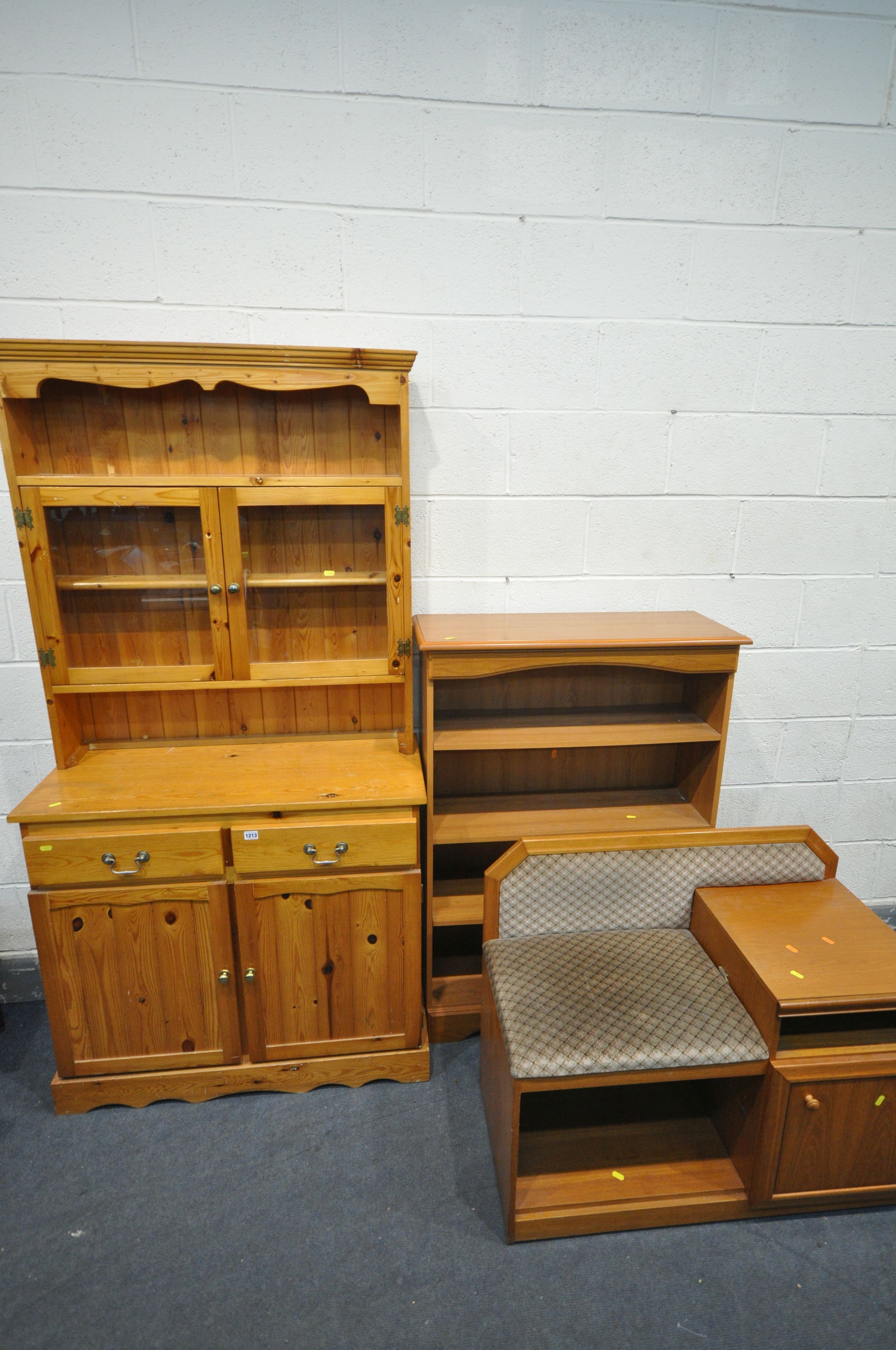 A PINE BOOKCASE, top with two glazed doors, base with two drawers over two doors, width 95cm x depth
