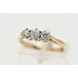 A 9CT YELLOW GOLD THREE STONE DIAMOND RING, designed with three claw set, round brilliant cut