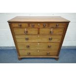 A GEORGE III WALNUT CHEST OF DRAWERS, with an unusual configuration of three small drawers, above