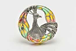 A WHITE METAL PLIQUE A JOUR PEACOCK BROOCH/PENDANT, of a circular openwork design, displaying a