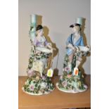 A PAIR OF LATE 19TH CENTURY SITZENDORF FLORAL ENCRUSTED FIGURAL CANDLESTICKS, modelled as a male and