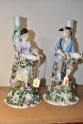 A PAIR OF LATE 19TH CENTURY SITZENDORF FLORAL ENCRUSTED FIGURAL CANDLESTICKS, modelled as a male and