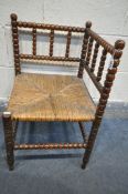 A VICTORIAN MAHOGANY BOBBIN TURNED CORNER CHAIR, with a rush seat, 42cm squared x height 68cm (