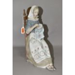 A LLADRO FIGURE INSULAR EMBROIDERESS, NO. 4865, sculpted by Salvador Furio, issued 1974-1994,