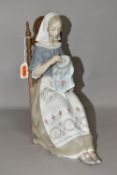 A LLADRO FIGURE INSULAR EMBROIDERESS, NO. 4865, sculpted by Salvador Furio, issued 1974-1994,