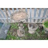 TWO COMPOSITE BIRD BATHS one in the form of an oyster shell on top of a tree stump height, 70cm