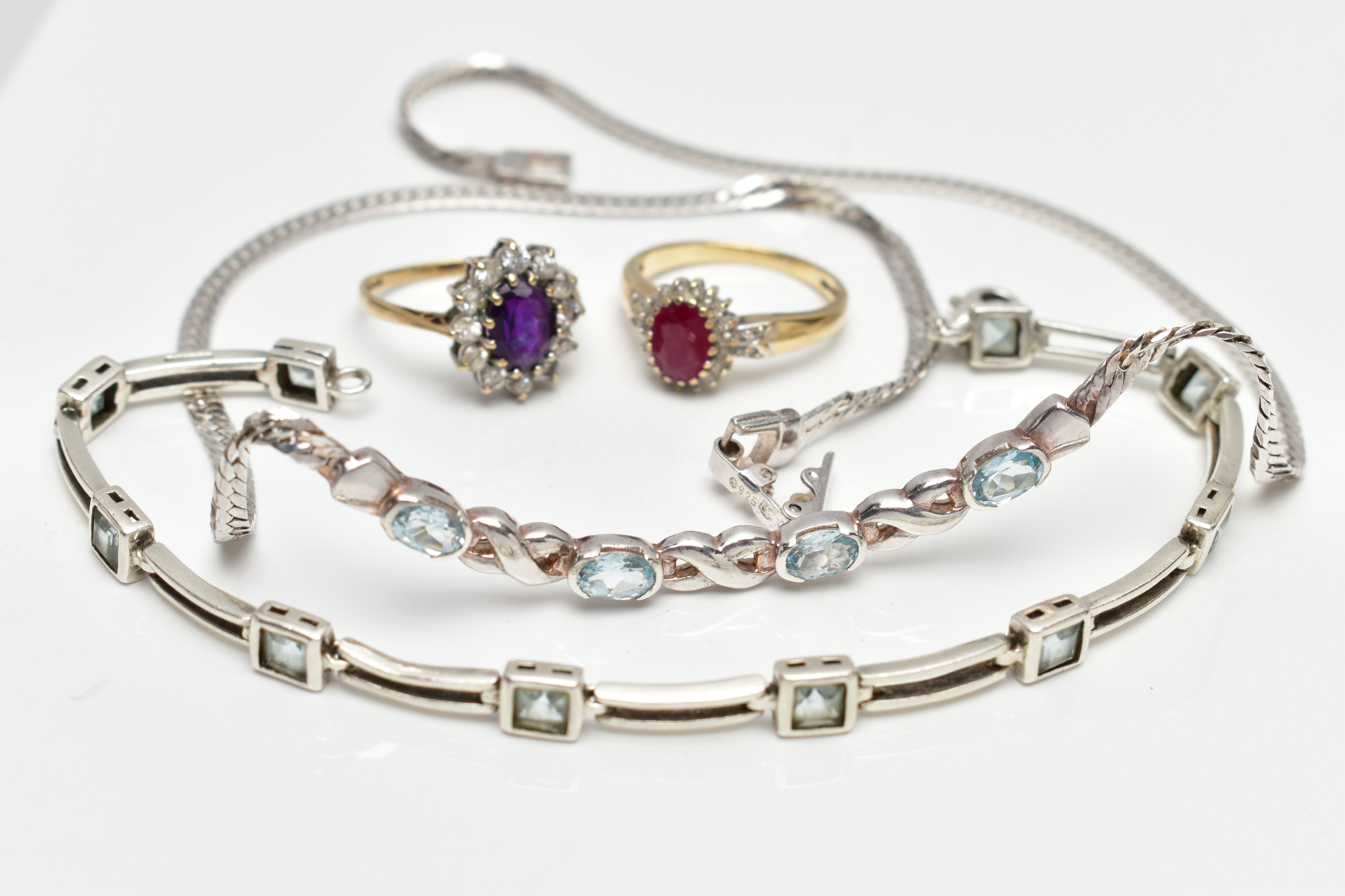 A SELECTION OF JEWELLERY, to include a 9ct gold glass filled ruby and diamond cluster ring,