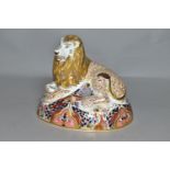 A ROYAL CROWN DERBY LION PAPERWEIGHT, marked as second quality with silver stopper, height 15cm,