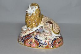 A ROYAL CROWN DERBY LION PAPERWEIGHT, marked as second quality with silver stopper, height 15cm,