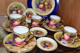 A GROUP OF AYNSLEY ORCHARD GOLD COFFEE WARES, comprising a 21cm plate, five coffee cans, seven