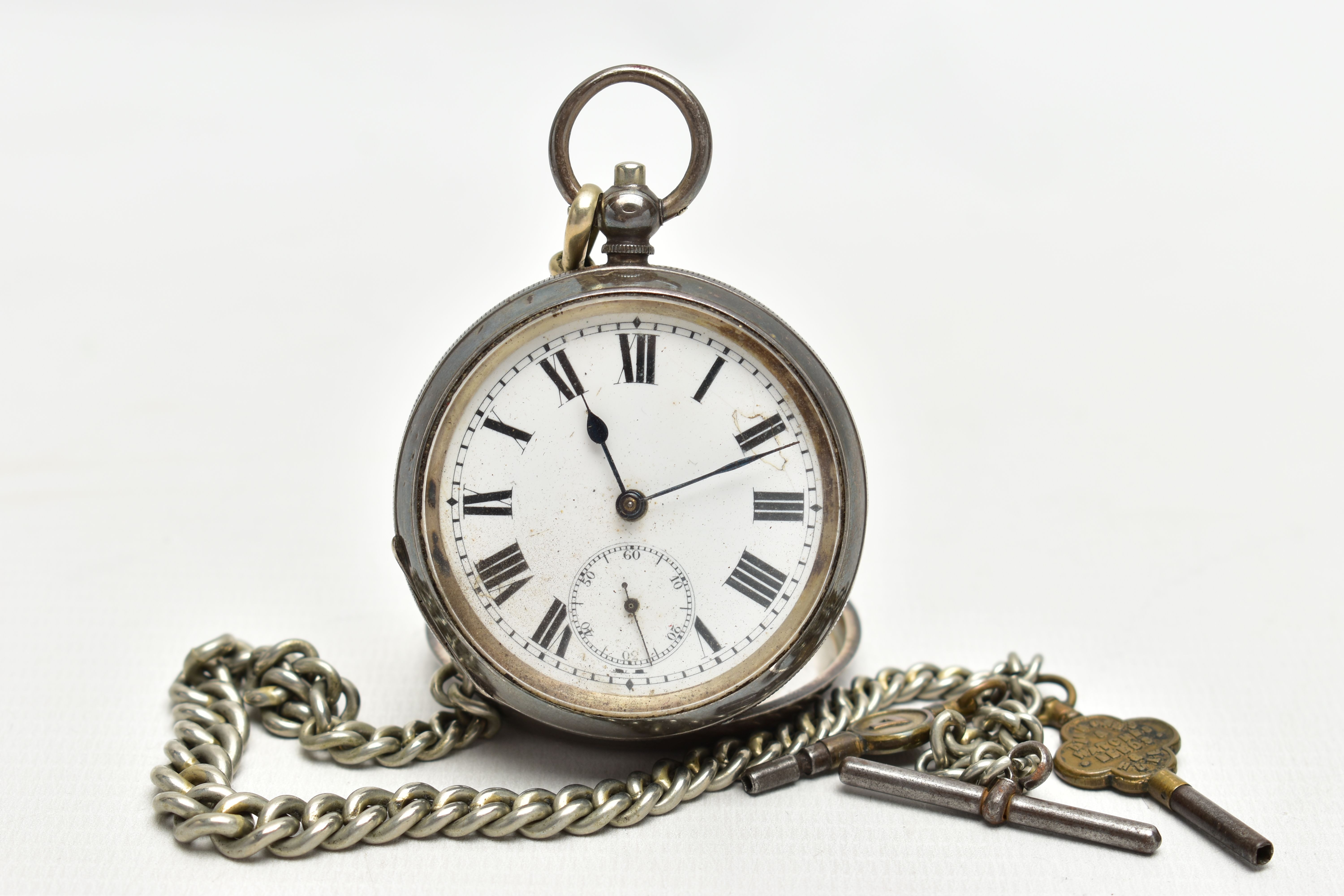 AN EARLY 20TH CENTURY SILVER OPEN FACE POCKET WATCH AND ALBERT CHAIN, the key wound pocket watch