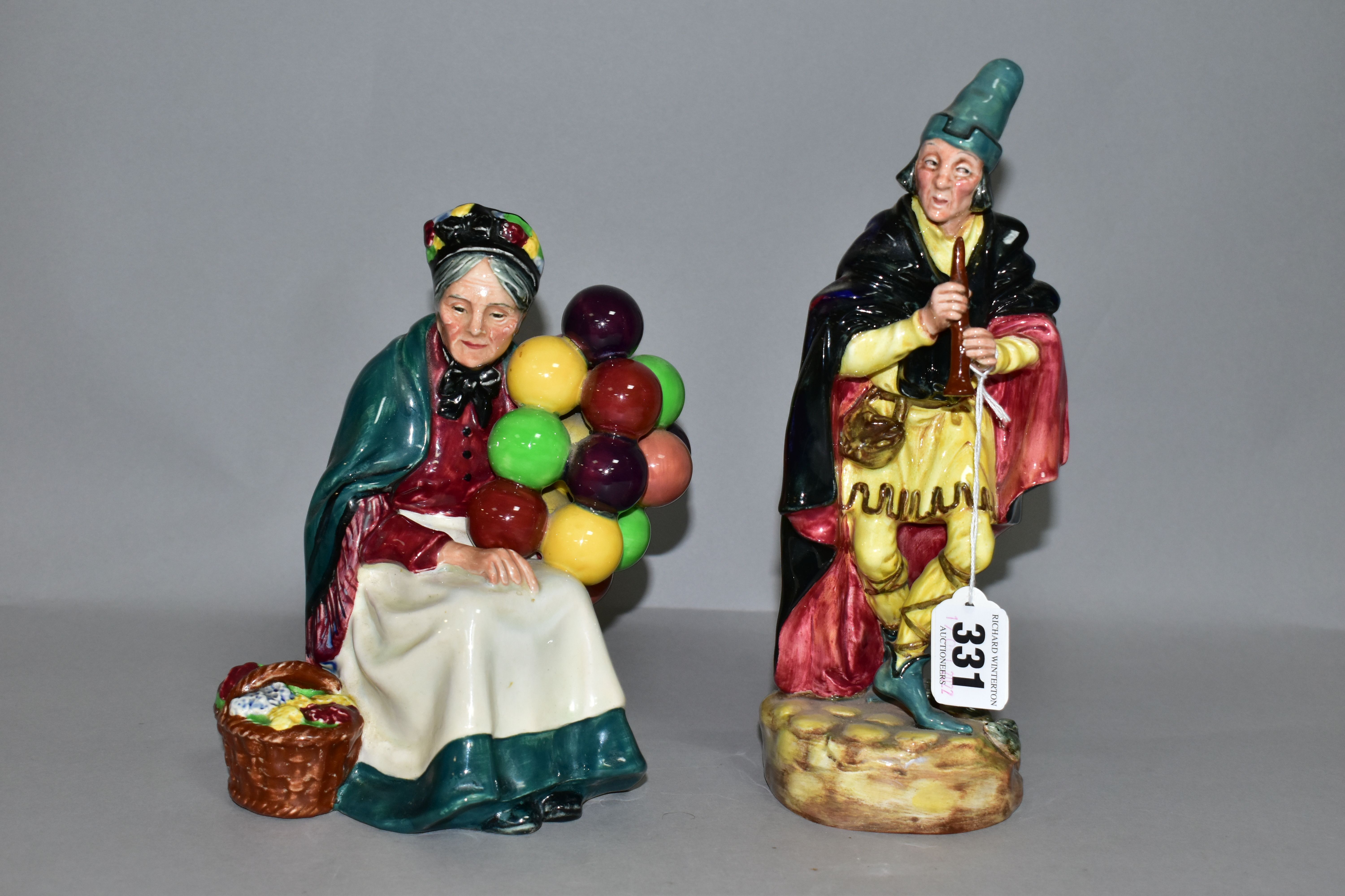 TWO ROYAL DOULTON FIGURINES, comprising The Pied Piper HN2102, height 23cm, and The Old Balloon