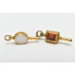 TWO WATCH KEYS, the first a yellow metal key set with an oval citrine and chalcedony panels,