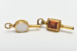 TWO WATCH KEYS, the first a yellow metal key set with an oval citrine and chalcedony panels,