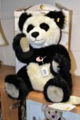 A BOXED STEIFF 'PANDA TED', black and white acrylic mix, jointed, yellow label, model no.010637,