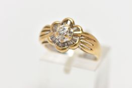 A MODERN YELLOW METAL DIAMOND CLUSTER RING, set with a principal round brilliant cut diamond, within